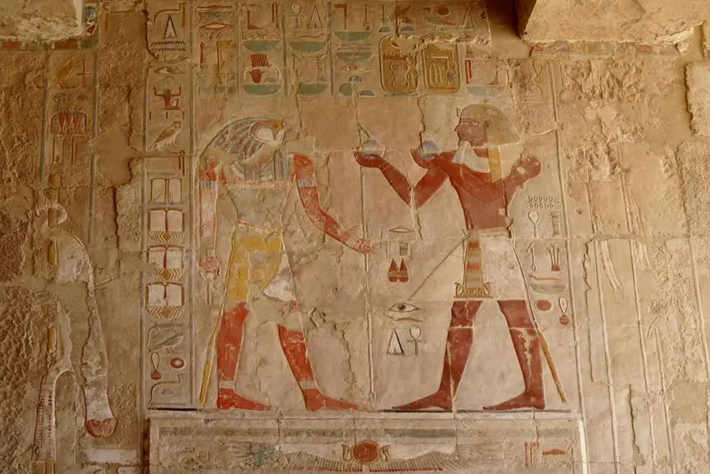 Ancient wall carvings and hieroglyphics at the Deir el-Bahari temple.