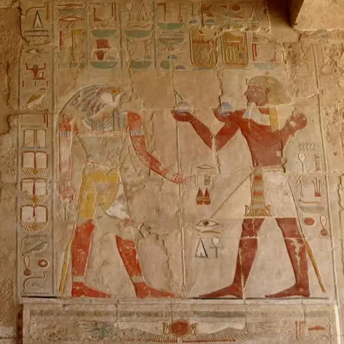 Ancient wall carvings and hieroglyphics at the Deir el-Bahari temple.