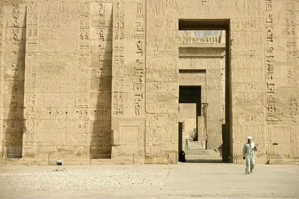 Ancient stone pillars at the Temple of Medinet Habu in Luxor.