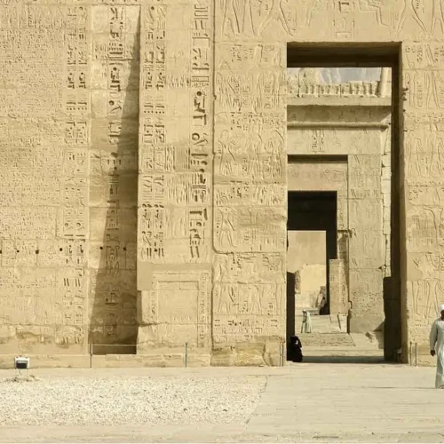 Ancient stone pillars at the Temple of Medinet Habu in Luxor.