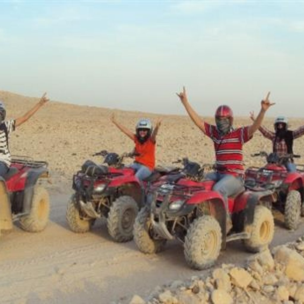 Group of tourists on a quad bike desert safari tour in Luxor.