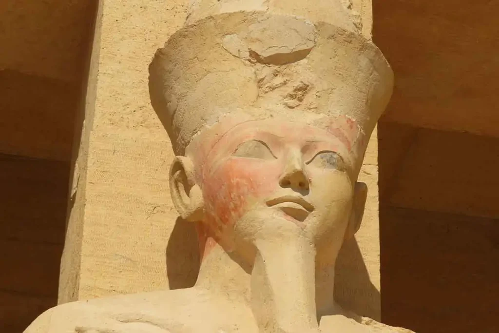 Close-up of an ancient Egyptian Pharaoh statue carving.
