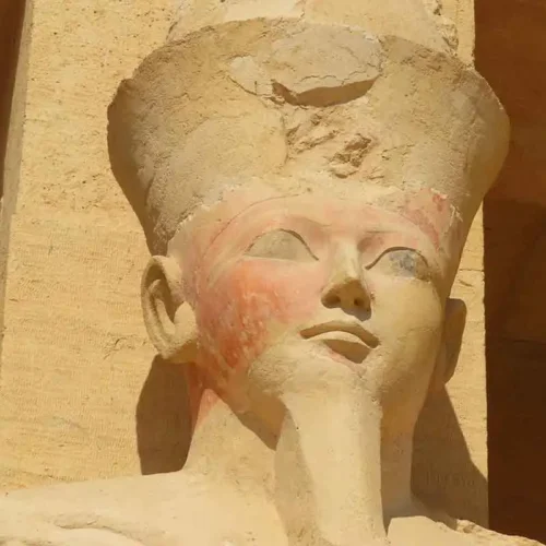 Close-up of an ancient Egyptian Pharaoh statue carving.