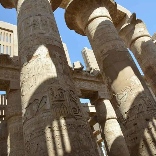 Close-up of monumental stone pillars at Karnak Temple.