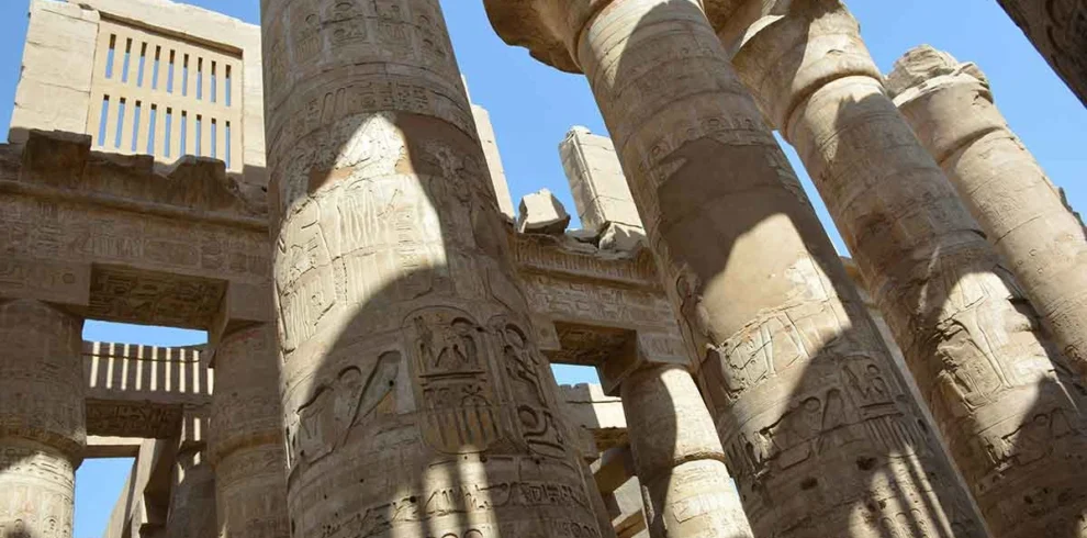 Close-up of monumental stone pillars at Karnak Temple.