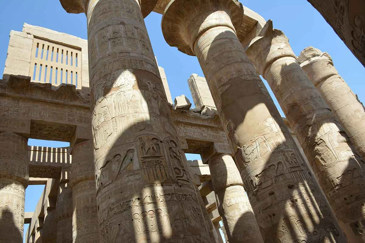 Close-up of monumental stone pillars at Karnak Temple.